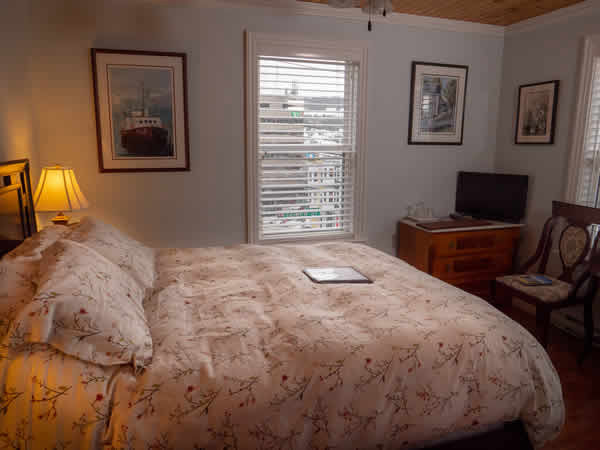 image: interior guest room with bed side view