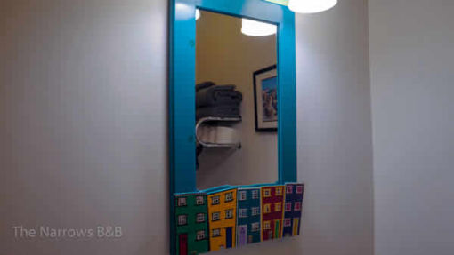 image: bathroom sink and towel area mirror